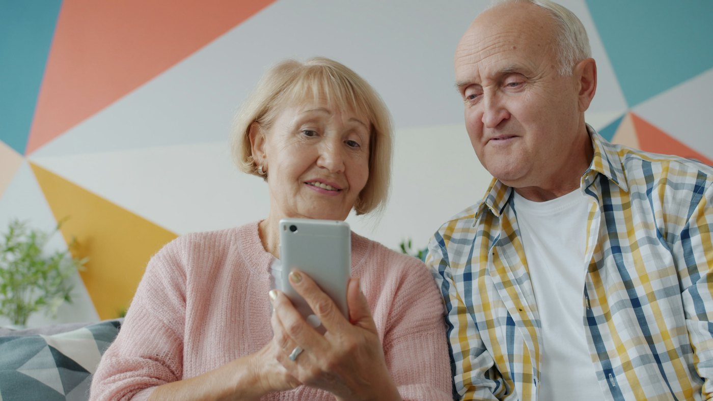Couple booking on a smartphone
